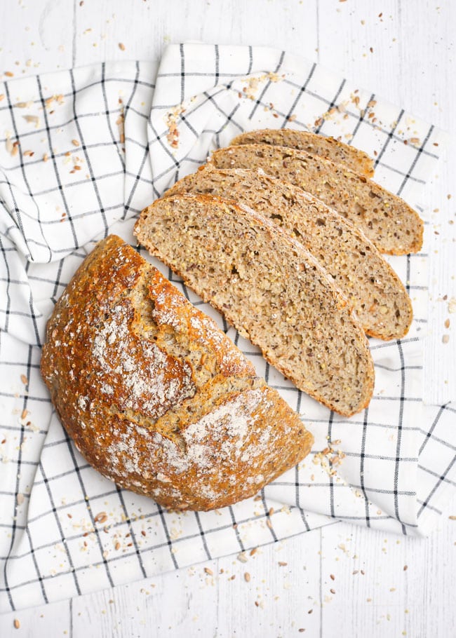 overhead photo of no knead multigrain bread sliced