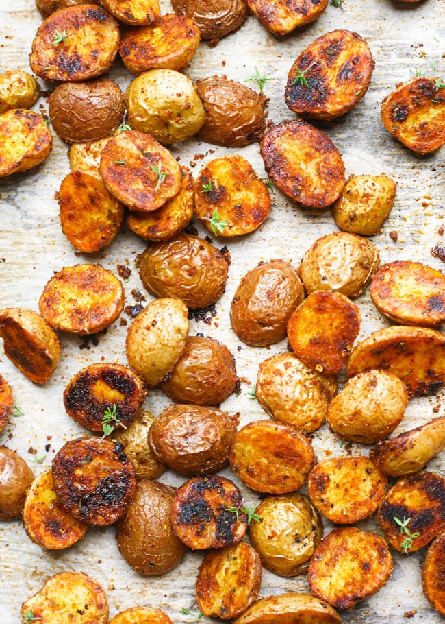 crispy roasted baby potatoes garnished with thyme