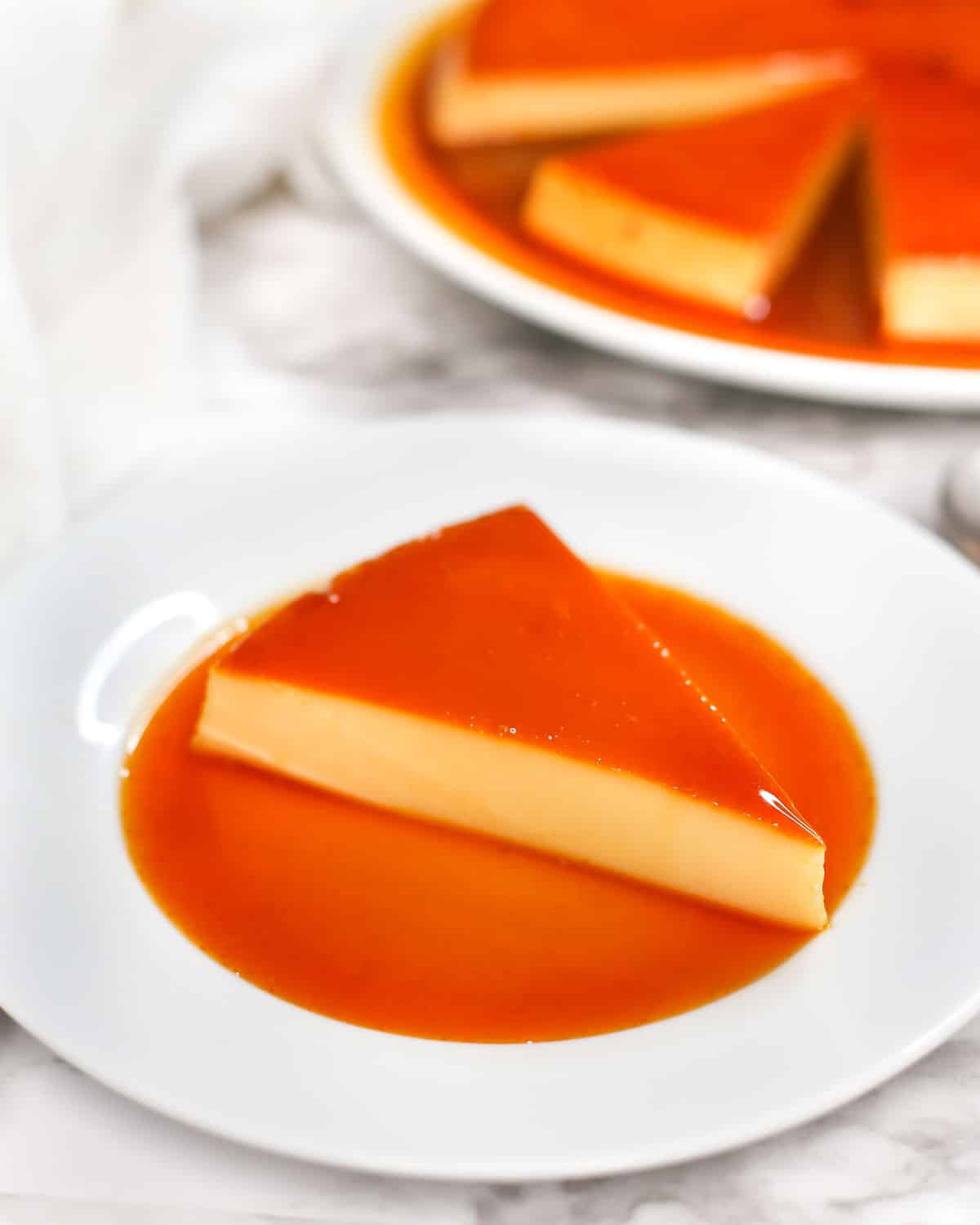 a slice of flan on a plate