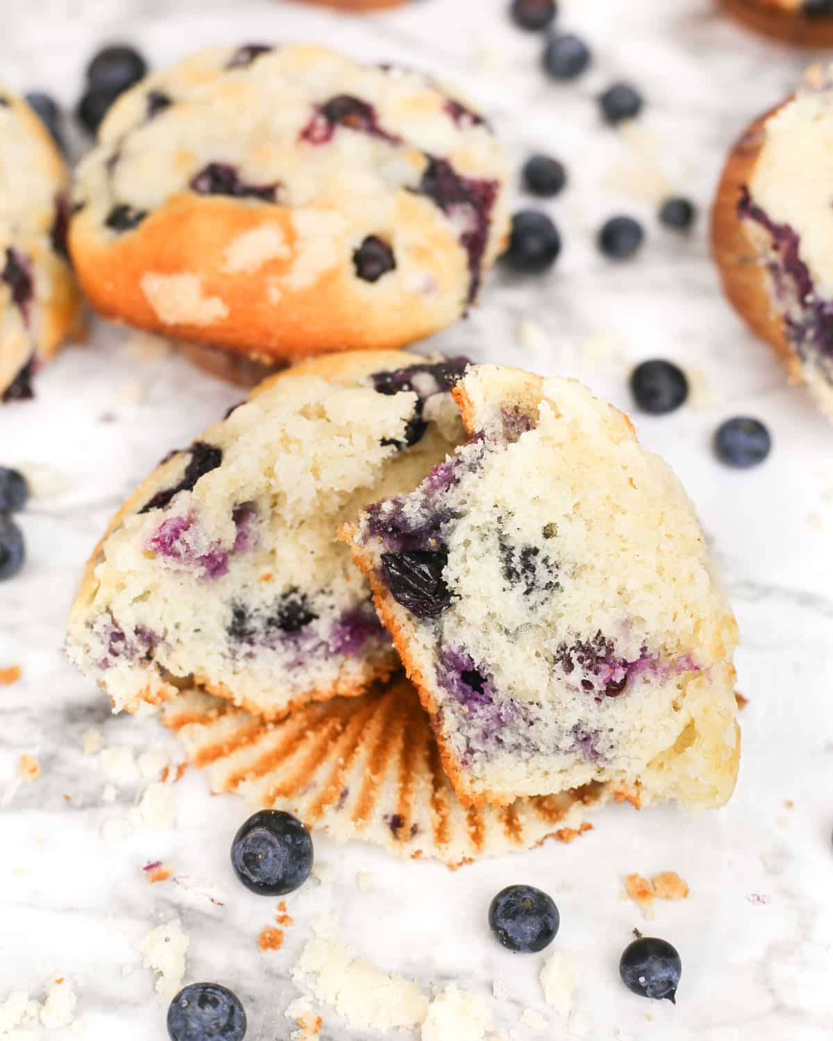 a blueberry streusel muffin split in half