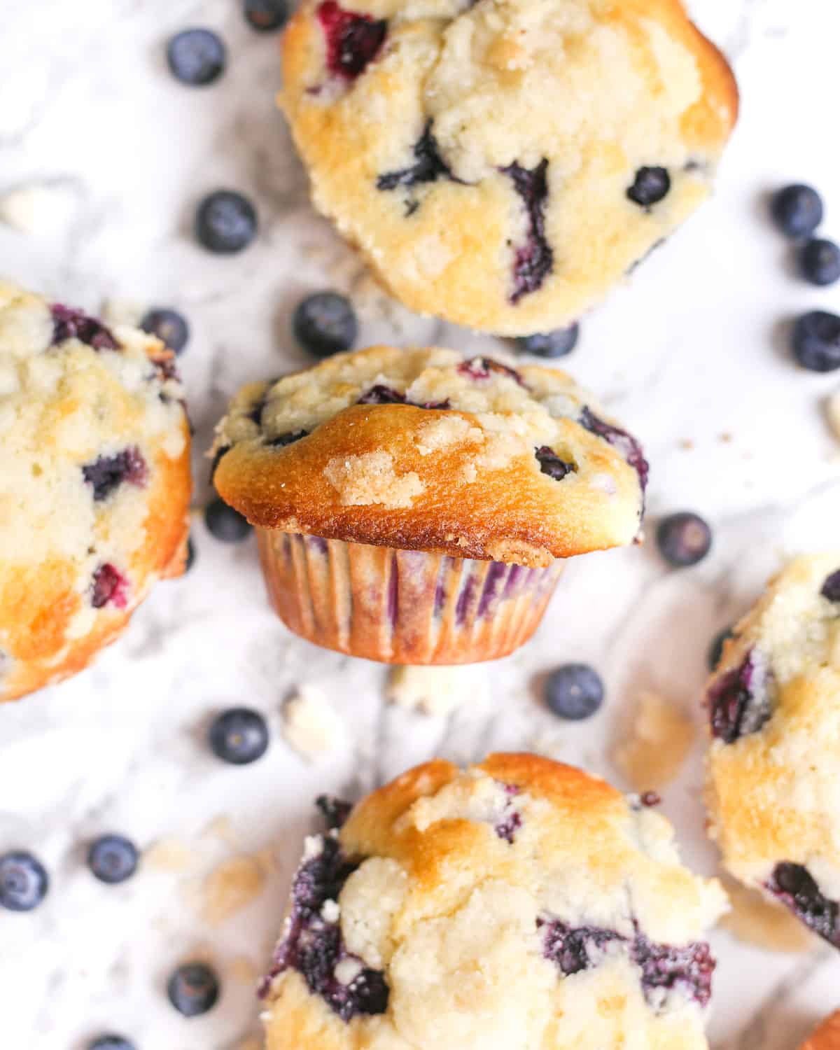 bakery style blueberry streusel muffins with one on its side