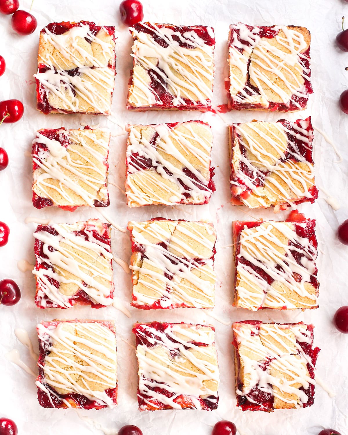 homemade cherry pie bars drizzled with glaze